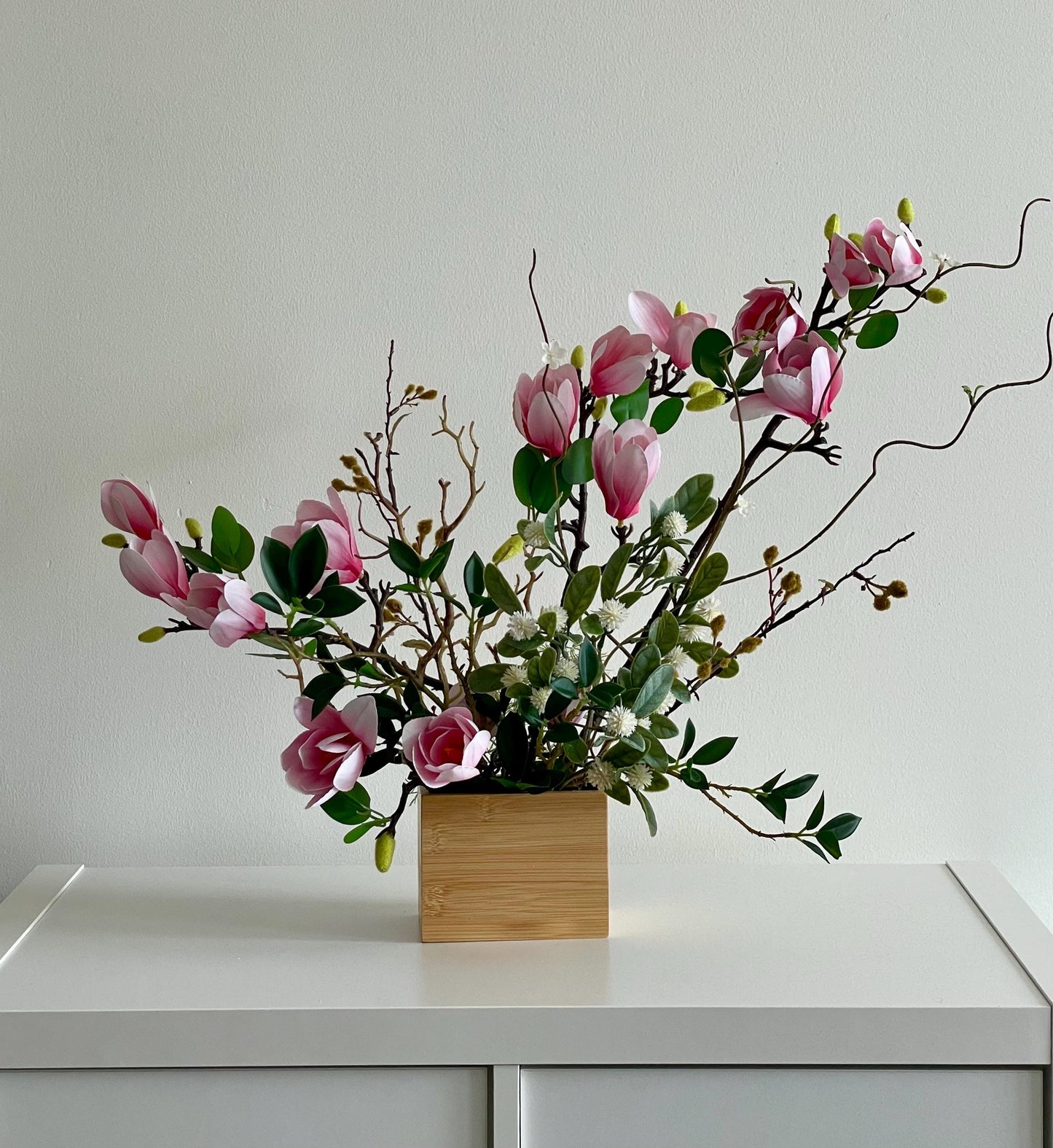 Silk Magnolia Centerpiece: Japanese Minimalist Floral Arrangement in Wood Vase