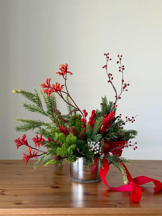 Artificial Christmas Centerpiece with Pine Greenery Berries and Red Ribbon in Glass Vase